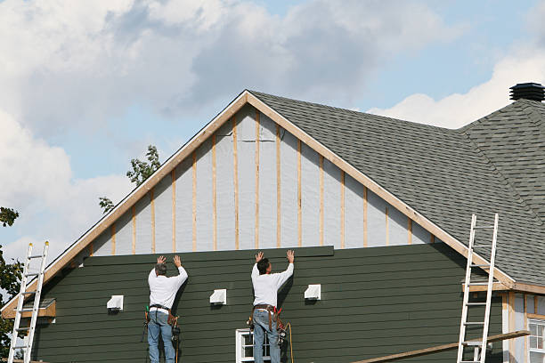Professional Storm Damage Siding Repair technician working in Marysville, OH